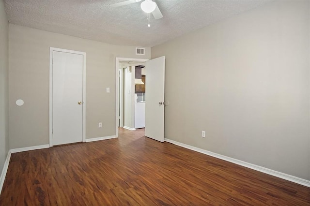 unfurnished bedroom featuring a textured ceiling, dark hardwood / wood-style floors, and ceiling fan