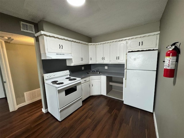 5825 NW 34th St, Oklahoma City, OK 73122 - kitchen featuring white appliances, under cabinet range hood, a sink, dark wood-style flooring, and a textured ceiling
