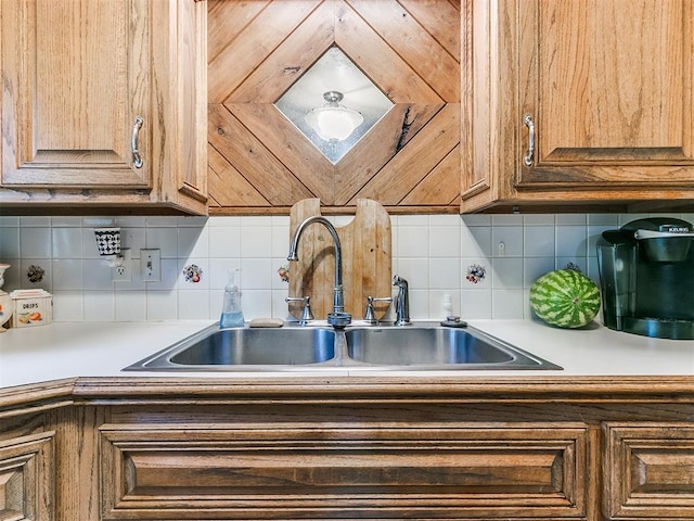 kitchen featuring backsplash and sink