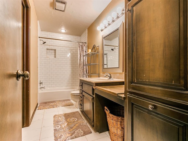 full bathroom featuring tile patterned floors, vanity, shower / bath combo, and toilet