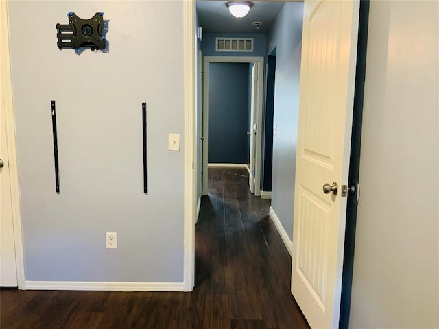 hallway featuring dark wood-type flooring