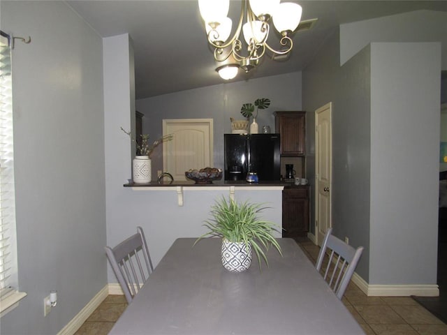 1617 NW 144th Ter, Edmond, OK 73013 - dining room featuring a chandelier, lofted ceiling, and light tile patterned flooring