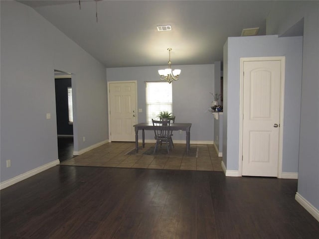 1617 NW 144th Ter, Edmond, OK 73013 - dining area with wood finished floors, a chandelier, and lofted ceiling