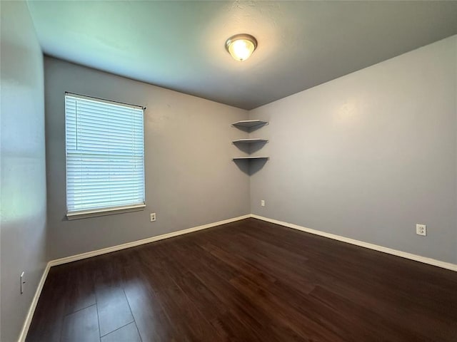 1617 NW 144th Ter, Edmond, OK 73013 - unfurnished room featuring dark wood-style floors and baseboards