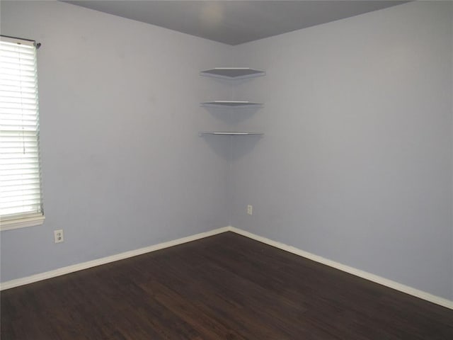 1617 NW 144th Ter, Edmond, OK 73013 - empty room featuring dark wood-style flooring and baseboards