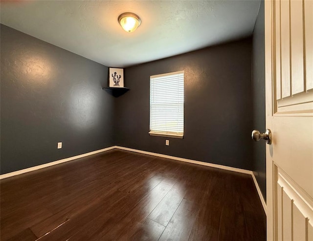 1617 NW 144th Ter, Edmond, OK 73013 - unfurnished room with wood finished floors and baseboards