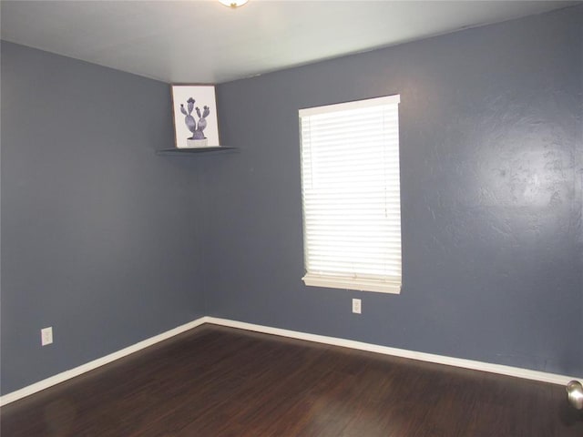 1617 NW 144th Ter, Edmond, OK 73013 - empty room with wood finished floors and baseboards