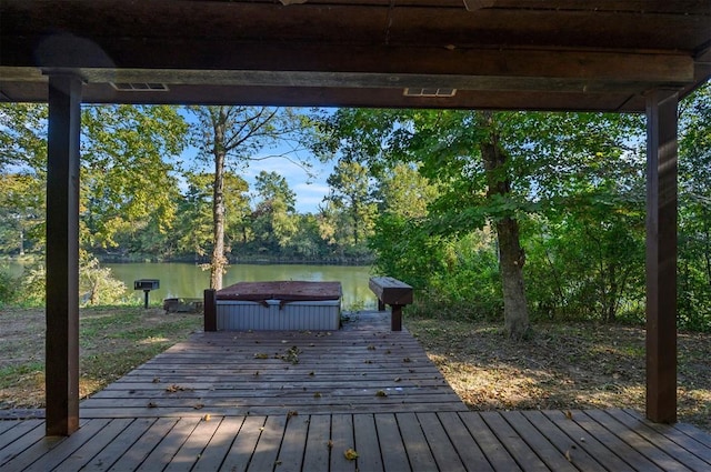 wooden deck featuring a water view