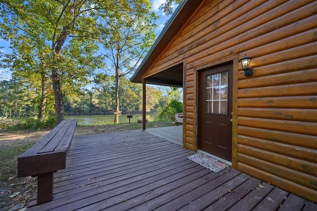 wooden deck featuring a water view