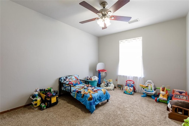 carpeted bedroom with ceiling fan