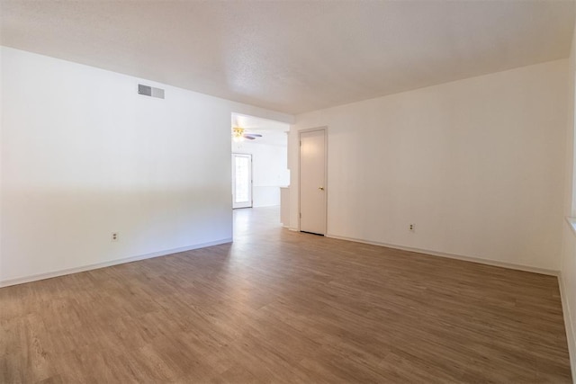 empty room with wood-type flooring