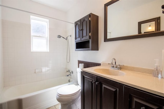 full bathroom featuring vanity, toilet, and tiled shower / bath