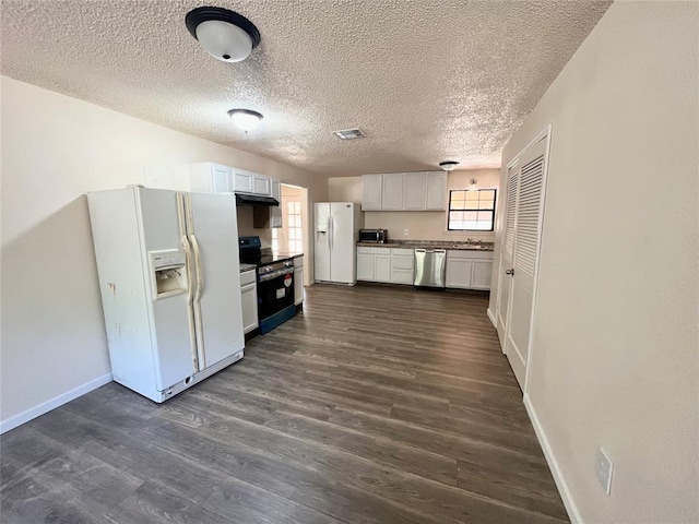 kitchen featuring sink, a textured ceiling, dark hardwood / wood-style flooring, white cabinetry, and stainless steel appliances