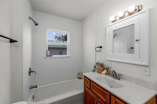 bathroom featuring vanity and washtub / shower combination