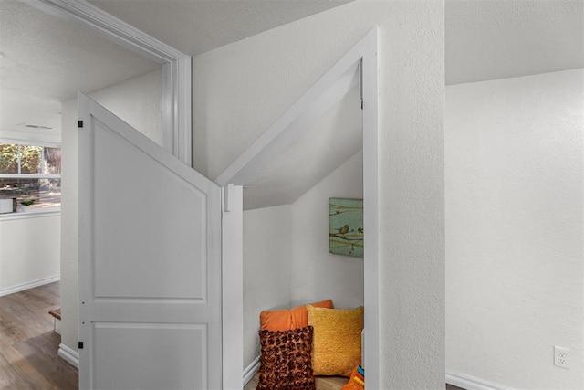 interior space with hardwood / wood-style floors and a textured ceiling