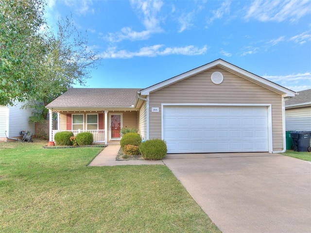 single story home featuring a front yard, a porch, and a garage