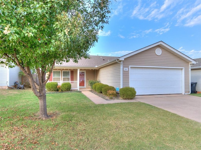 ranch-style home featuring a garage, covered porch, and a front yard