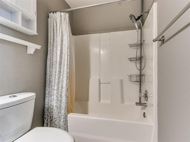 bathroom featuring toilet and shower / tub combo with curtain