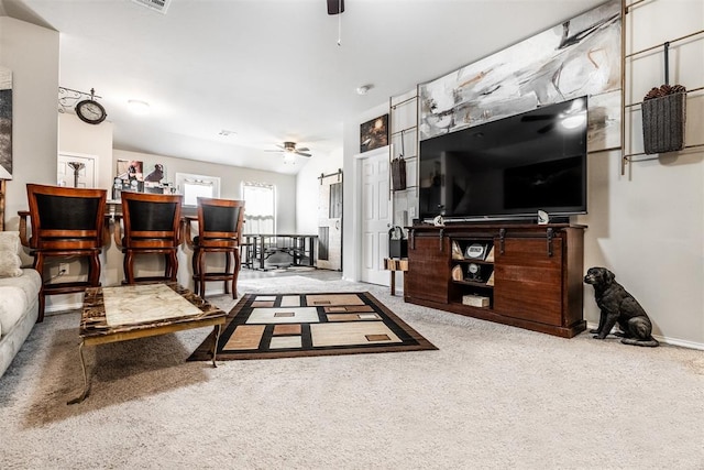 living room with ceiling fan and carpet