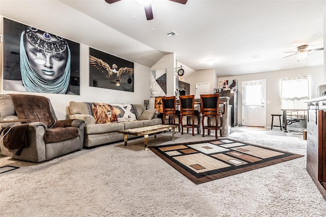 carpeted living room featuring ceiling fan