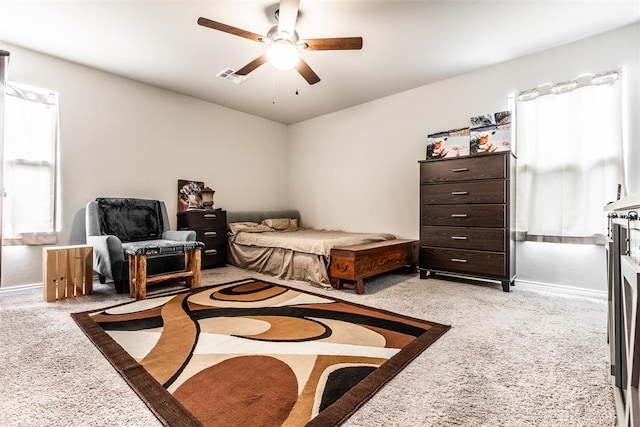 carpeted bedroom with ceiling fan