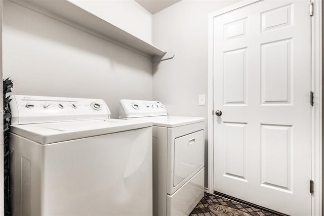 washroom with separate washer and dryer