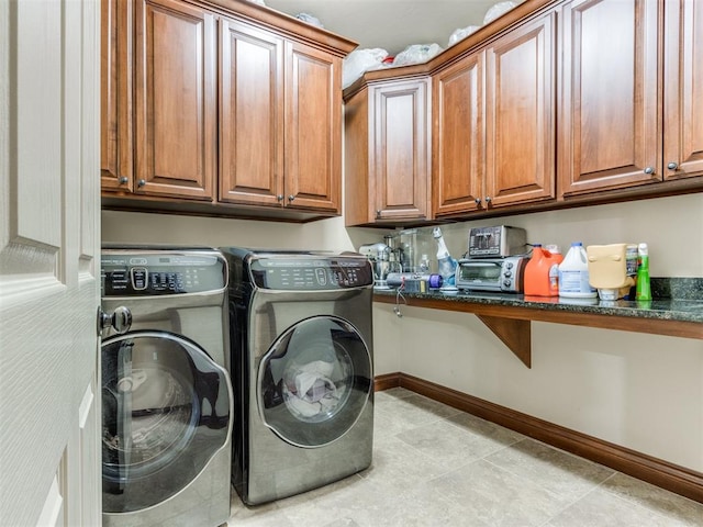 clothes washing area with cabinets, separate washer and dryer, and light tile patterned floors