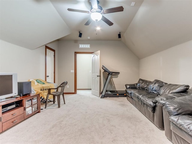 living room with ceiling fan, light colored carpet, and vaulted ceiling