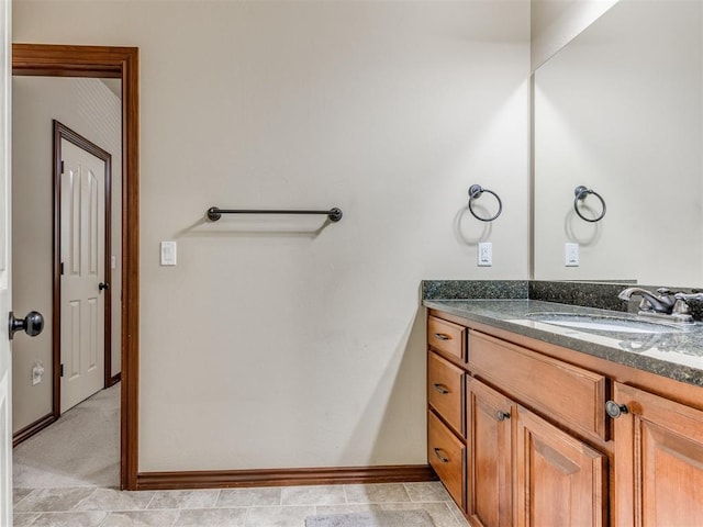 bathroom with tile patterned floors and vanity