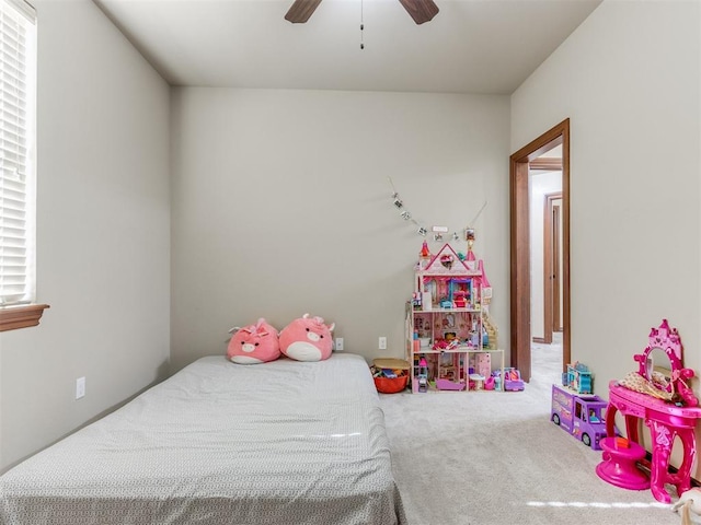 bedroom featuring ceiling fan and carpet floors