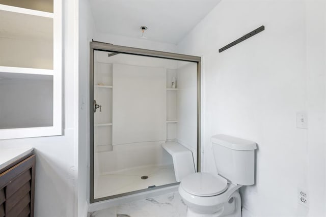 bathroom featuring vanity, a shower stall, toilet, and marble finish floor