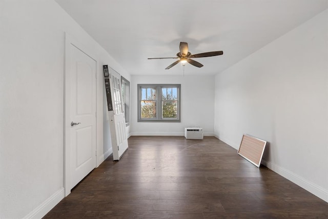 unfurnished bedroom featuring an AC wall unit, ceiling fan, and dark hardwood / wood-style flooring