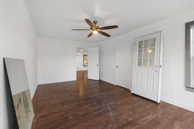 unfurnished bedroom with ceiling fan, baseboards, and wood finished floors