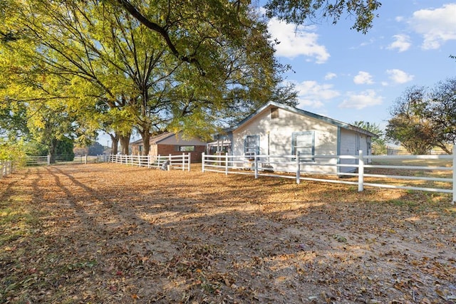 view of front of house featuring fence