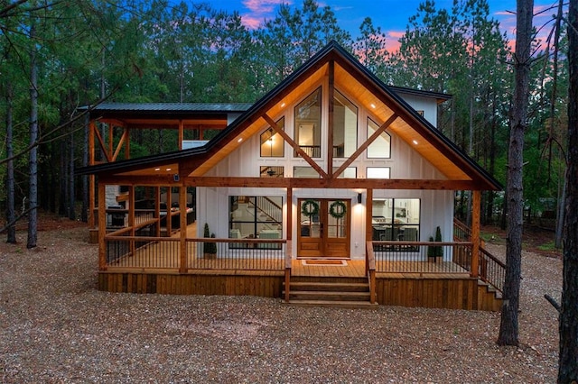 view of front of house with a porch and french doors