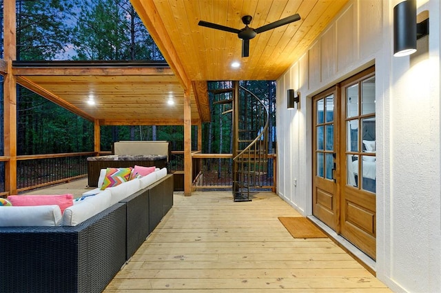 wooden terrace featuring outdoor lounge area and french doors