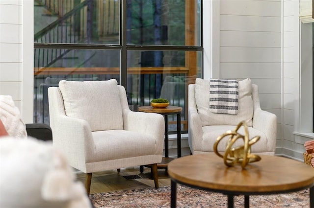 sitting room with hardwood / wood-style flooring