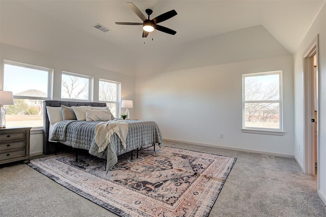 carpeted bedroom featuring multiple windows, visible vents, and baseboards