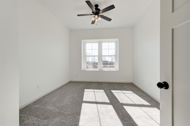 unfurnished room featuring carpet floors, baseboards, and a ceiling fan