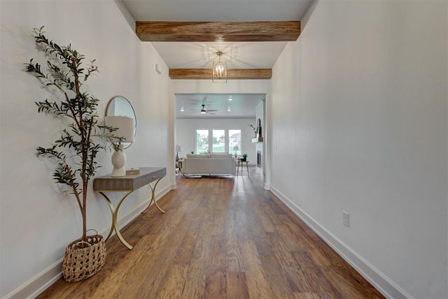 14500 Rushing Ln, Edmond, OK 73025 - foyer entrance featuring beamed ceiling, wood finished floors, baseboards, and ceiling fan