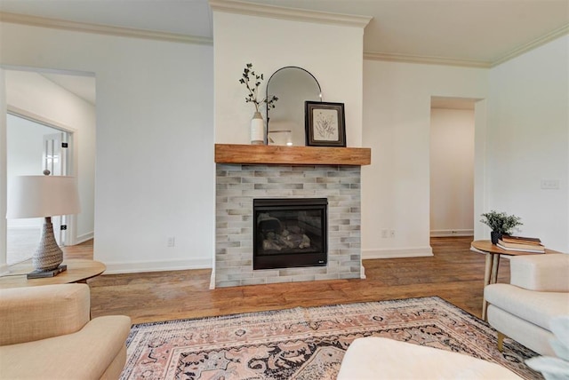 14500 Rushing Ln, Edmond, OK 73025 - living room with wood finished floors, a brick fireplace, ornamental molding, and baseboards
