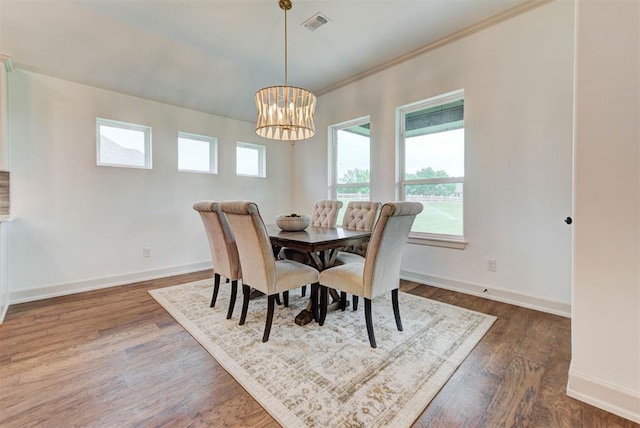 14500 Rushing Ln, Edmond, OK 73025 - dining room featuring dark wood-type flooring, a chandelier, and baseboards