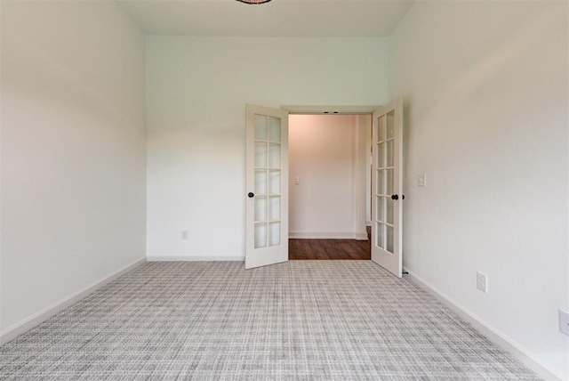14500 Rushing Ln, Edmond, OK 73025 - carpeted spare room with french doors and baseboards