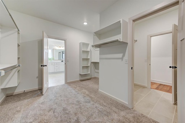 14500 Rushing Ln, Edmond, OK 73025 - walk in closet with light colored carpet