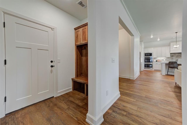 14500 Rushing Ln, Edmond, OK 73025 - mudroom featuring light wood-style flooring and baseboards