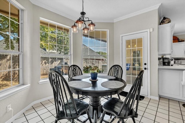 sunroom / solarium featuring a notable chandelier