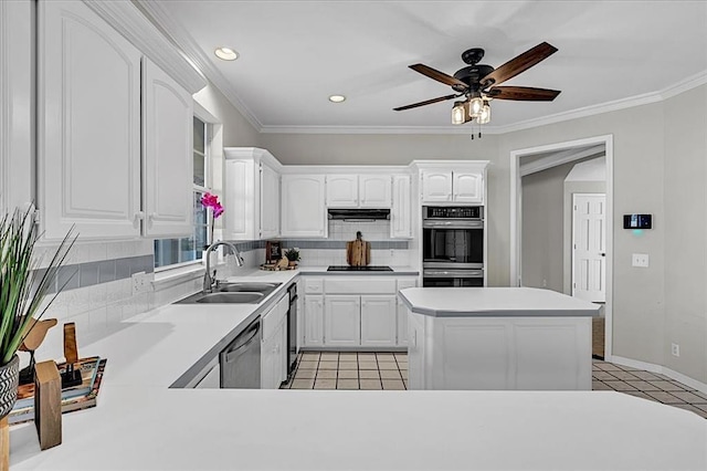 kitchen featuring sink, crown molding, appliances with stainless steel finishes, tasteful backsplash, and white cabinets