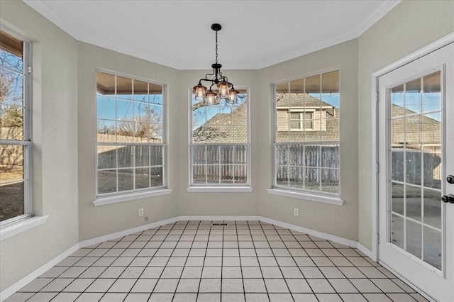 unfurnished sunroom featuring a chandelier