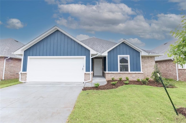 12333 SW 30th St, Yukon, OK 73099 - ranch-style house with a garage, a front yard, board and batten siding, and driveway