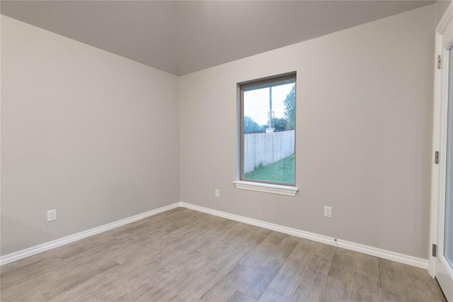 12333 SW 30th St, Yukon, OK 73099 - spare room with light wood-type flooring and baseboards
